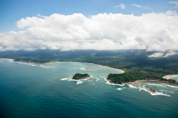 Costa Rica's Pacific coast with forested islands and blue water