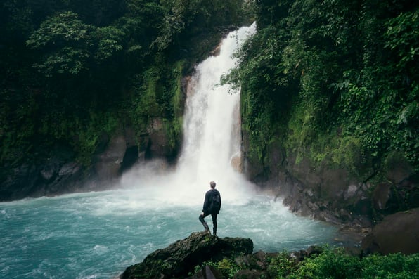 Tropical waterfall surrounded by lush Costa Rican rainforest